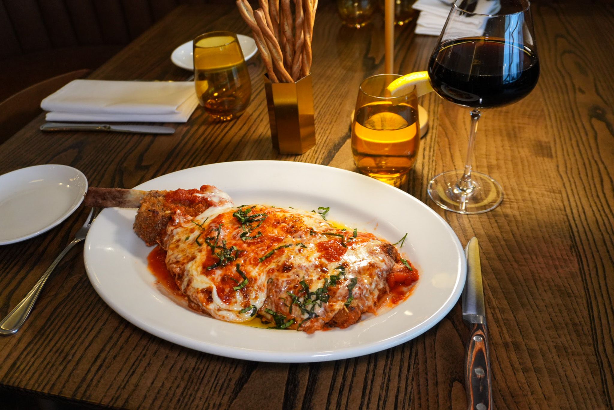 Luogo Restaurant signature dishes Spicy Lobster PastaWhipped Ricotta with Truffle HoneyVeal Chop ParmesanTuna Crudo﻿﻿